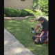 An off-duty Lansing, Ill,. cop was caught on video forcibly pinning down a black teen just for being on his property. (Facebook screenshot)